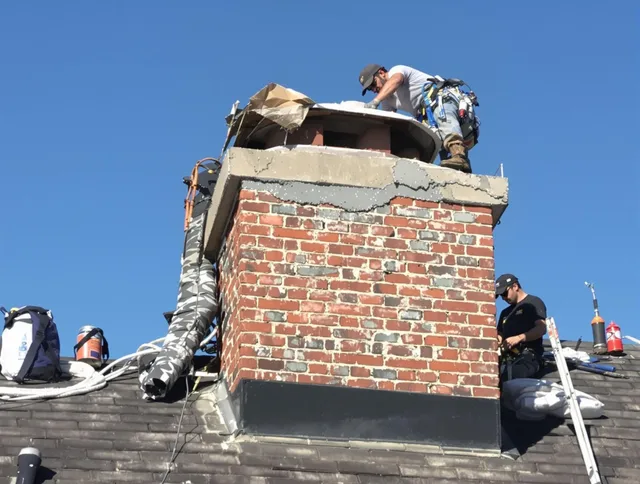 Cromwell Chimney Sweep installing a custom chimney crown in Cromwell, CT