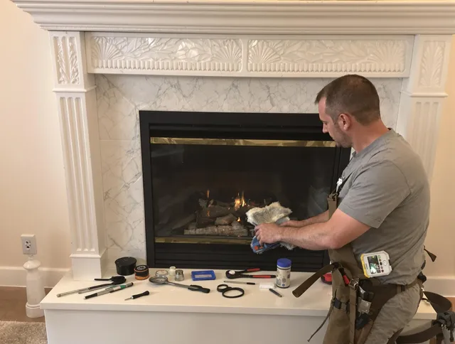 Cromwell Chimney Sweep performing fireplace maintenance in Cromwell, CT