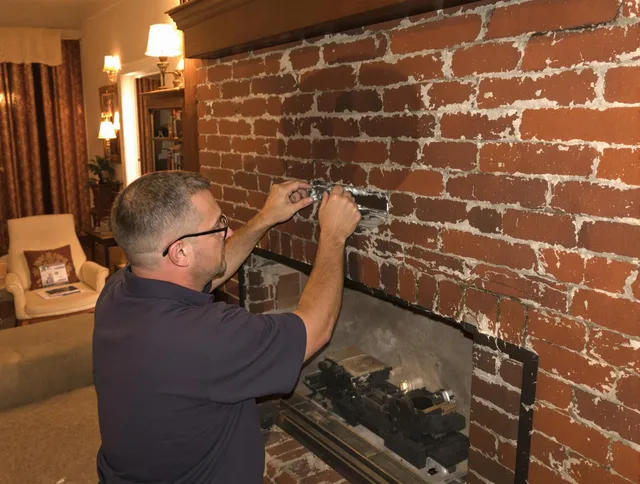 Cromwell Chimney Sweep expert fixing a fireplace in Cromwell, CT